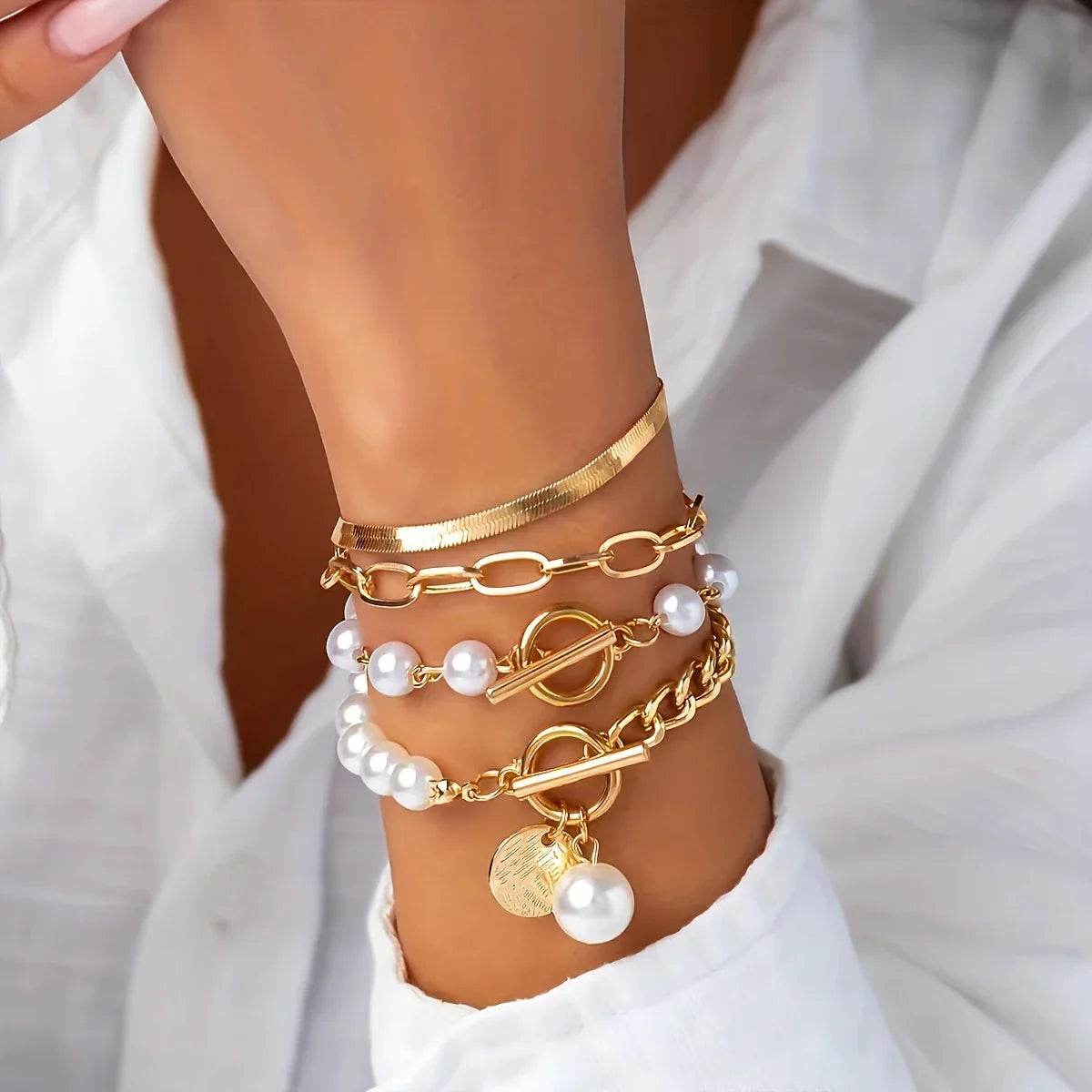 Set of 4 Gold-Tone Bracelets with Bright Pearls