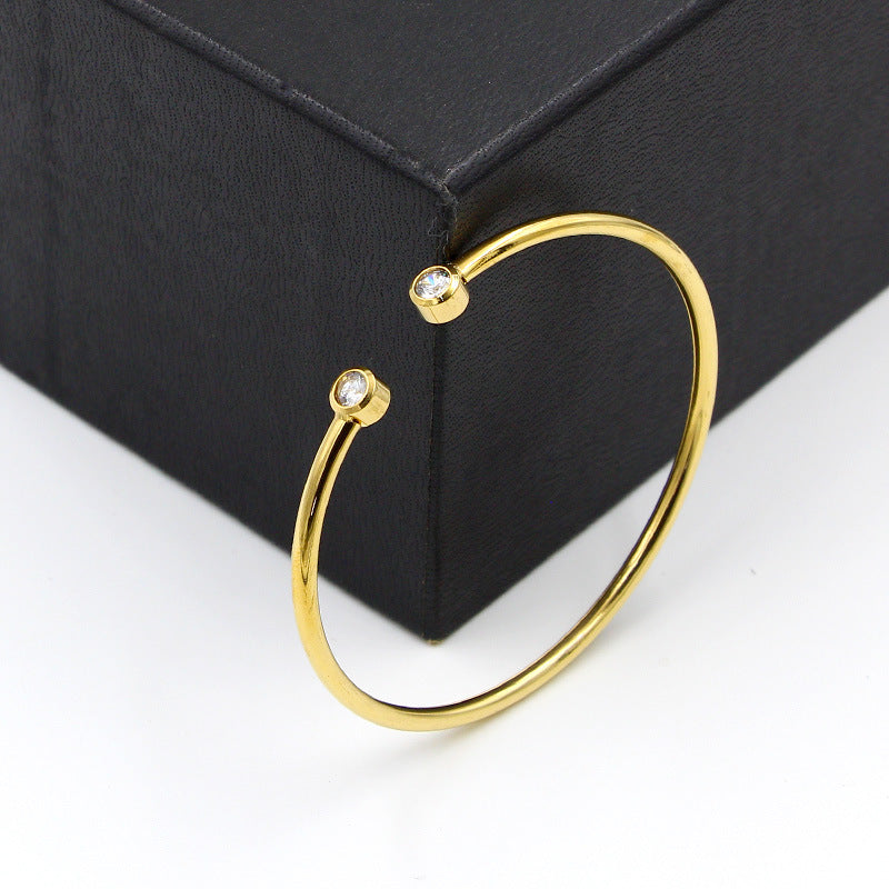 Open Gold-Tone Bracelet with Twin Crystals