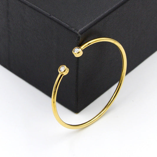 Open Gold-Tone Bracelet with Twin Crystals