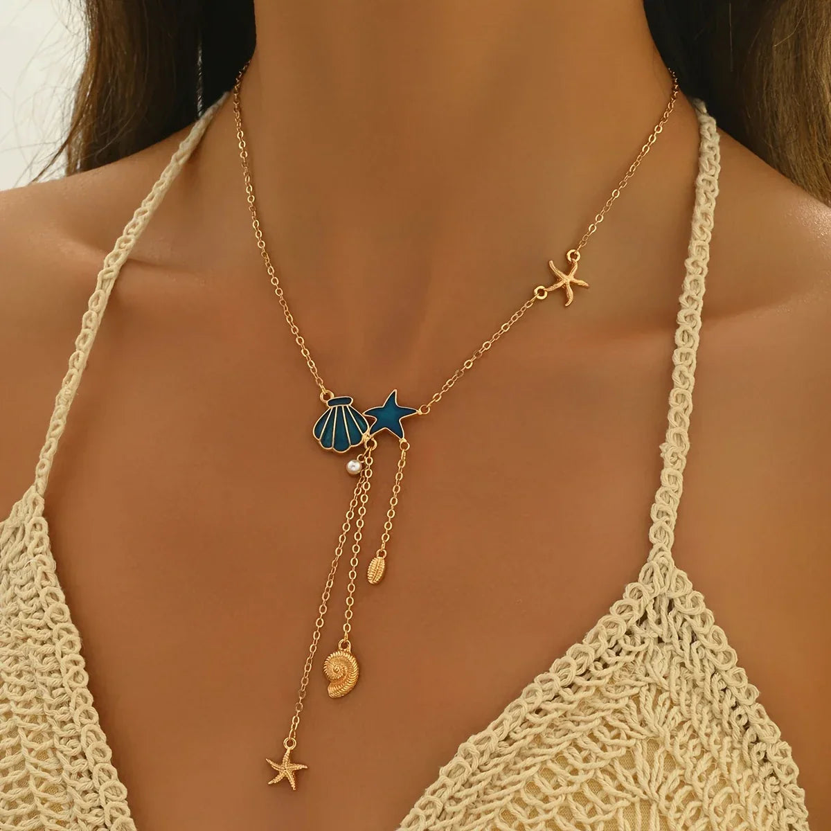 Elegant Gold-Tone Necklace with Star and Blue Shell