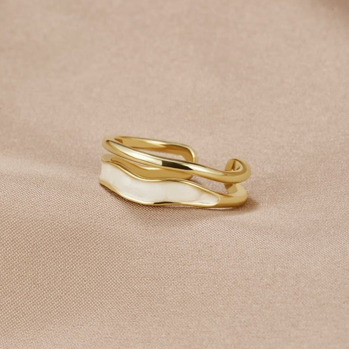 Elegant Gold-Tone Ring with White Enamel