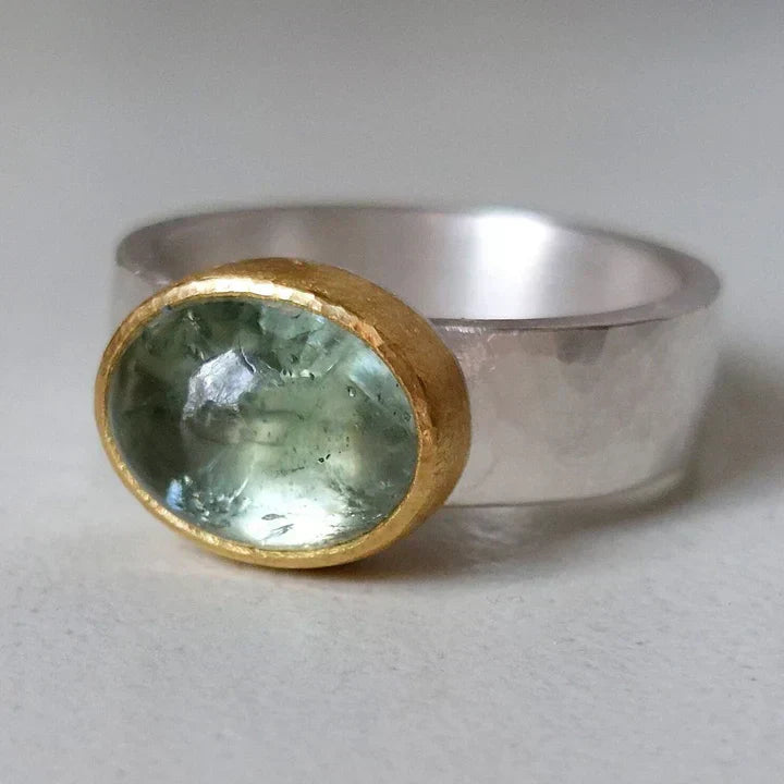 Green ring with rounded stone vintage